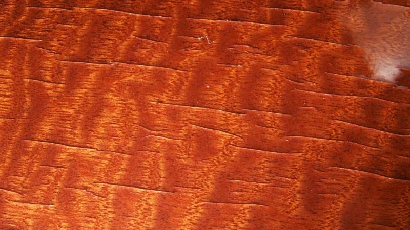 Lacquer cracking and surface damage on wood
